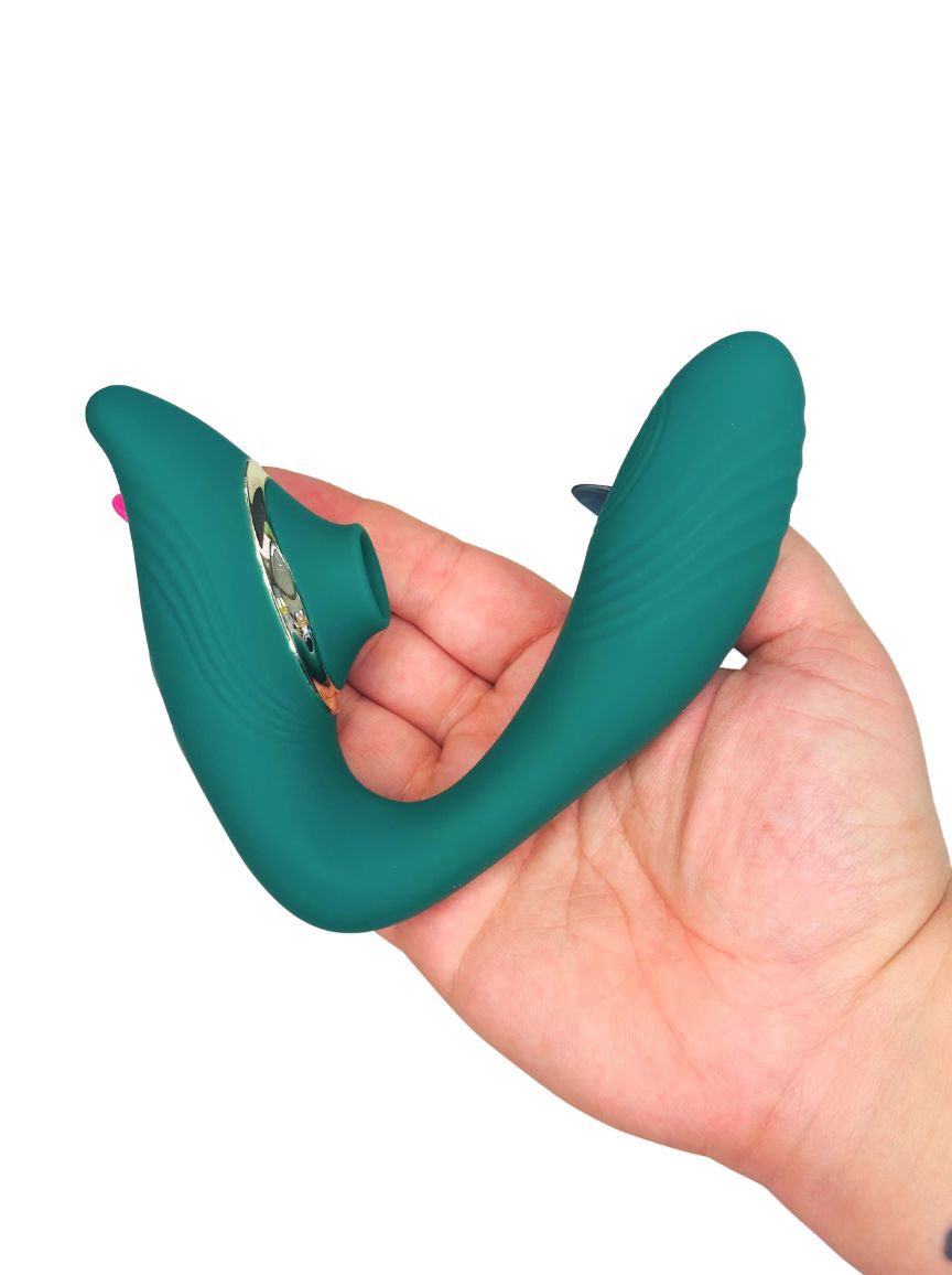Teal hand personal massager adult toy in a hand on a white background
